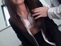 Dark-haired beauty gives a sensual blowjob in the office